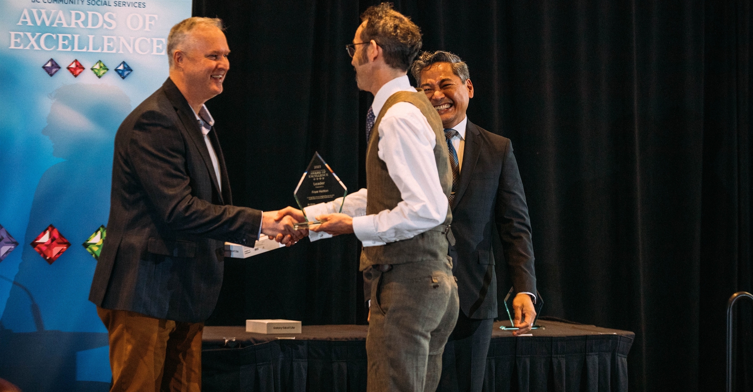 Recipient receiving award